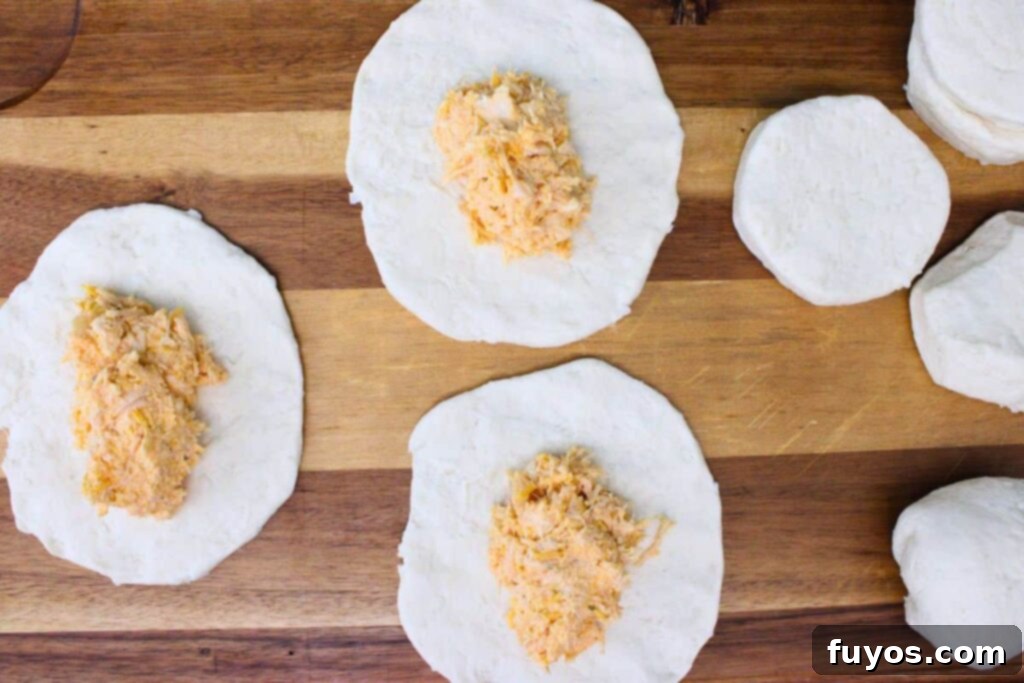 Game Day Air Fryer Buffalo Chicken Bombs 7 add two mounded tablespoons of chicken mixture to each biscuit