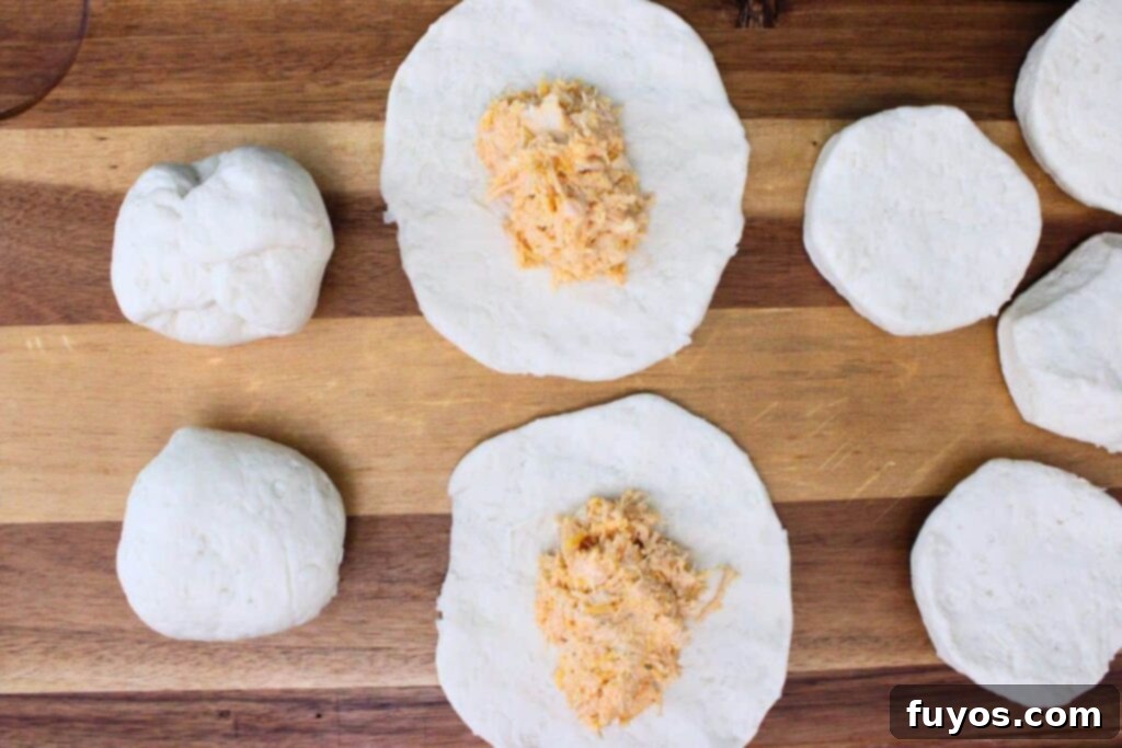 Game Day Air Fryer Buffalo Chicken Bombs 8 form a ball over the buffalo chicken mixture