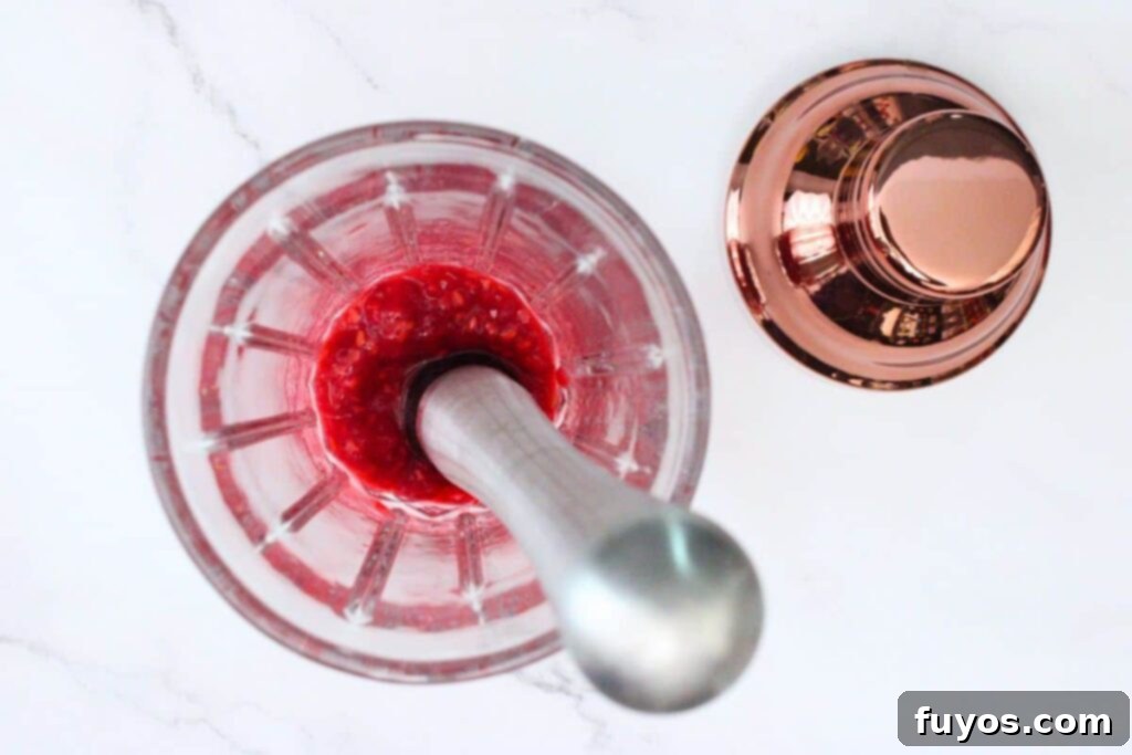 The Ultimate Homemade Raspberry Lemon Drop Cheesecake 6 muddle raspberries in the bottom of your shaker