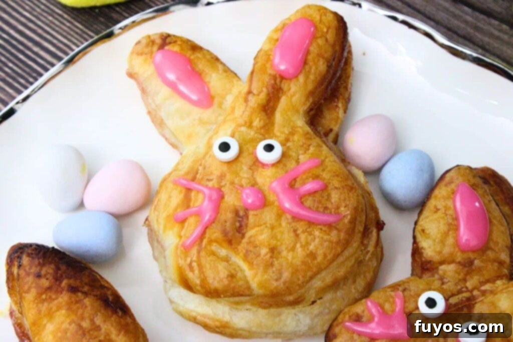 Cute Easter Air Fryer Puff Pastry Bunnies 3 air fryer puff pastry bunny on a plate with candy eyes and an icing nose plus whiskers
