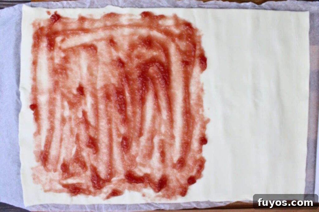 Cute Easter Air Fryer Puff Pastry Bunnies 6 spread strawberry jam over half the puff pastry