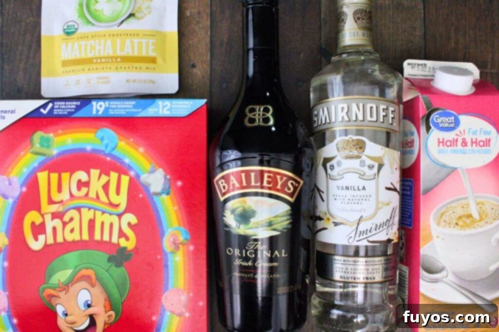 St Patricks Day Lucky Charms Baileys Martini 4 All the ingredients laid out for making the Lucky Charms martini including vodka, Baileys, half and half, matcha powder, and Lucky Charms cereal.
