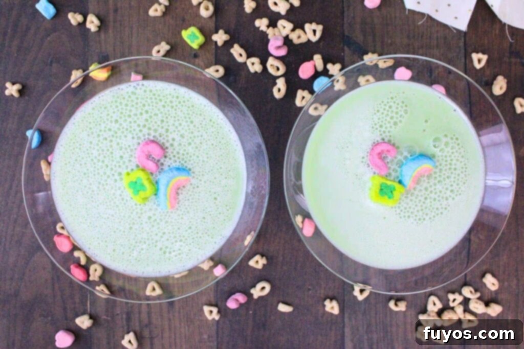 St Patricks Day Lucky Charms Baileys Martini 8 Overhead view of two beautifully garnished Lucky Charms martini cocktails with cereal and marshmallows.