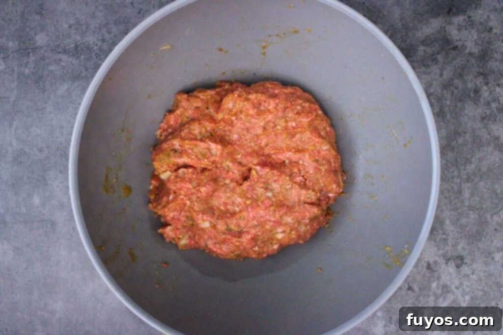 Spooky Halloween Air Fryer Mummy Meatloaf 5 combine meatloaf ingredients except crescent dough and eyeballs in a large bowl