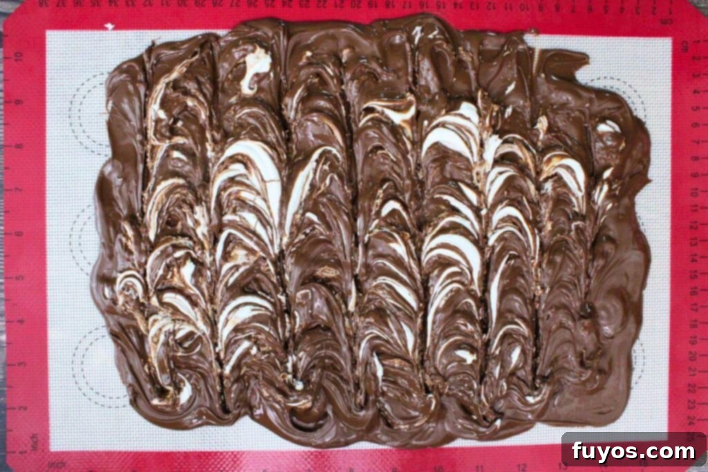 add marshmallow fluff and white chocolate mixture over chocolate