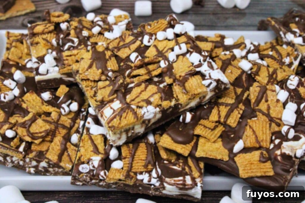 platter of smores bark stacked on top of each other with golden grahams
