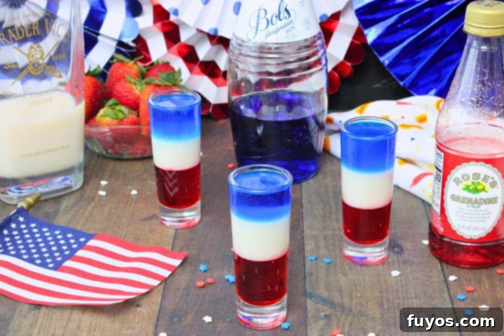 Stacked Red White Blue Party Shots 3 three red white and blue shots surrounded by liquor bottles in a patriotic scene with a small american flag
