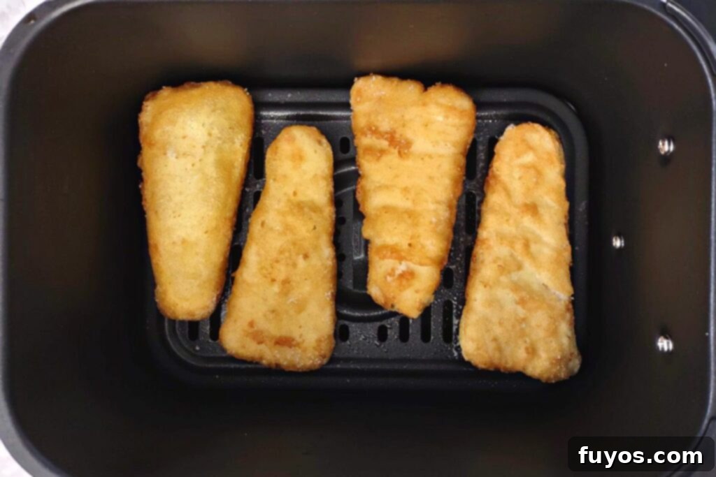 Air Fryer Frozen Fish Crispy and Quick 5 frozen battered fish in air fryer basket
