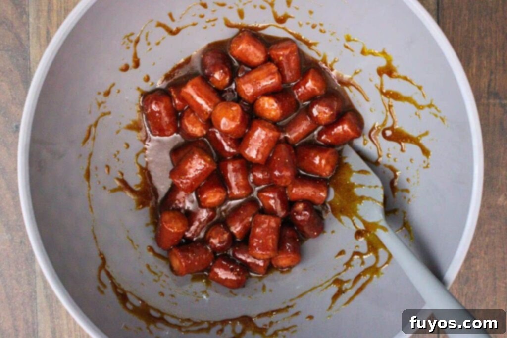 Air Fryer Hot Dog Burnt Ends A Speedy BBQ Spin 6 toss hot dog pieces in a bowl with bbq glaze ingredients