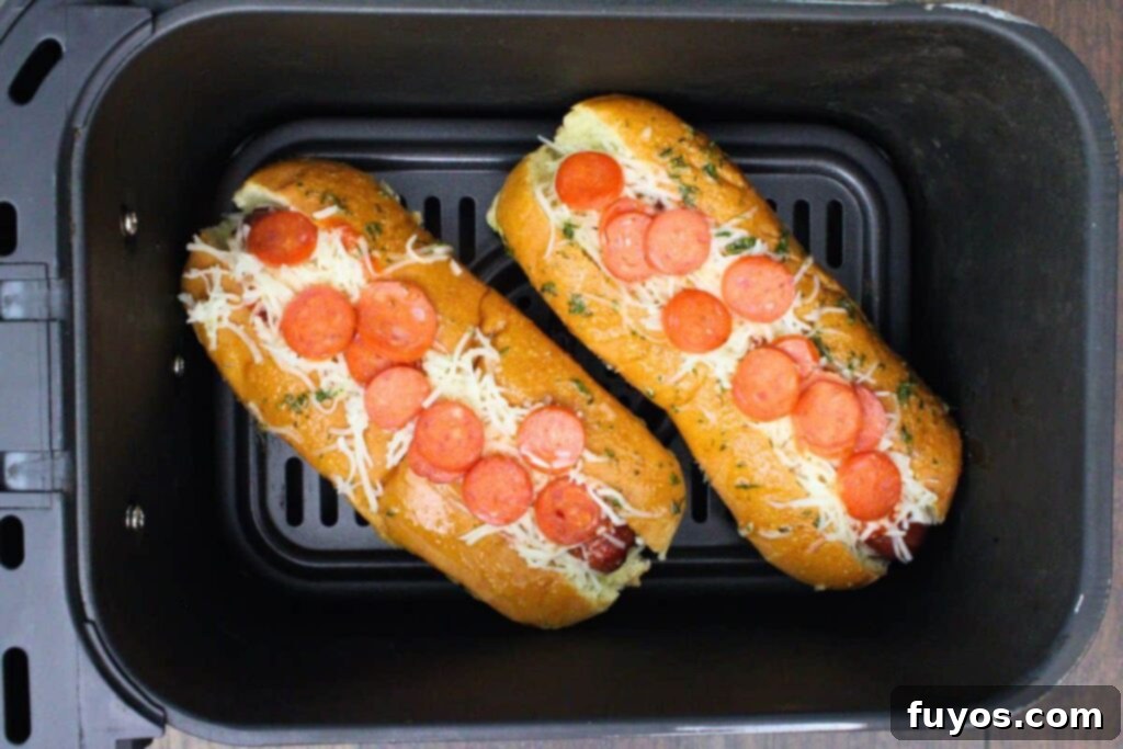 Pizza Hot Dogs: Your Go-To 30-Minute Flavor Fusion 8 place pizza hot dogs back in air fryer basket to melt cheese