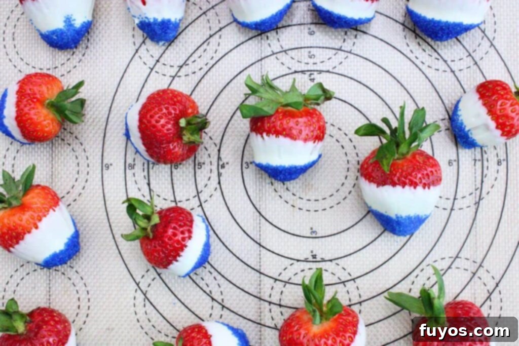 after dipping tips of strawberries in blue sanding sugar line them on your baking sheet