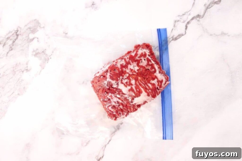 Mastering Microwave Defrosting for Ground Beef 4 remove frozen ground beef from plastic wrapping or ziploc bag