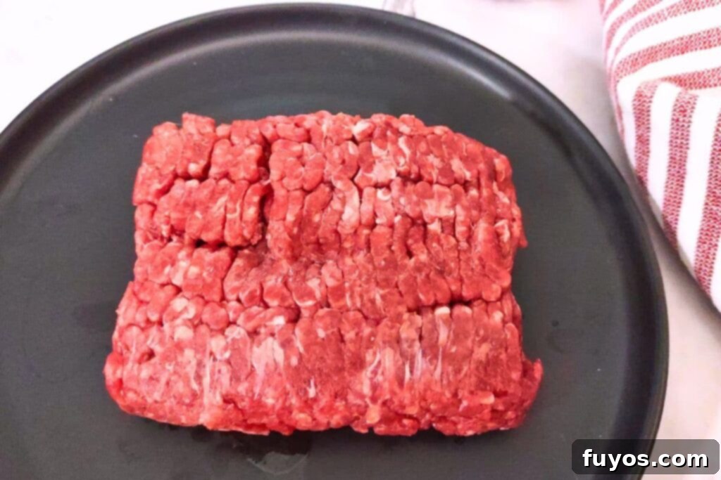 Mastering Microwave Defrosting for Ground Beef 9 thawed ground beef from the microwave on a black plate