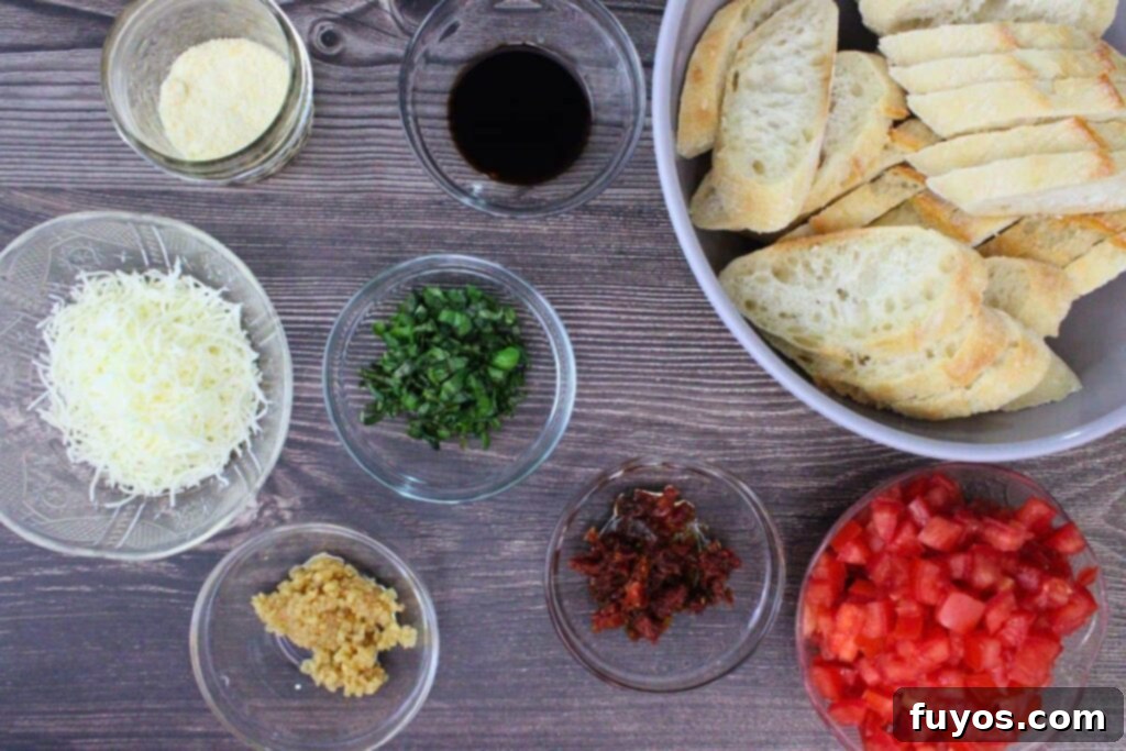 Ingredients for making Air Fryer Bruschetta, including fresh tomatoes, basil, garlic, and baguette