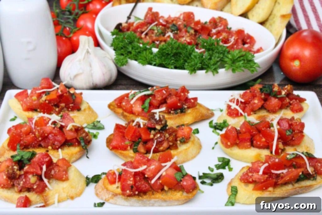 Platter of Air Fryer Bruschetta slices with a bowl of fresh tomato topping, ready to serve