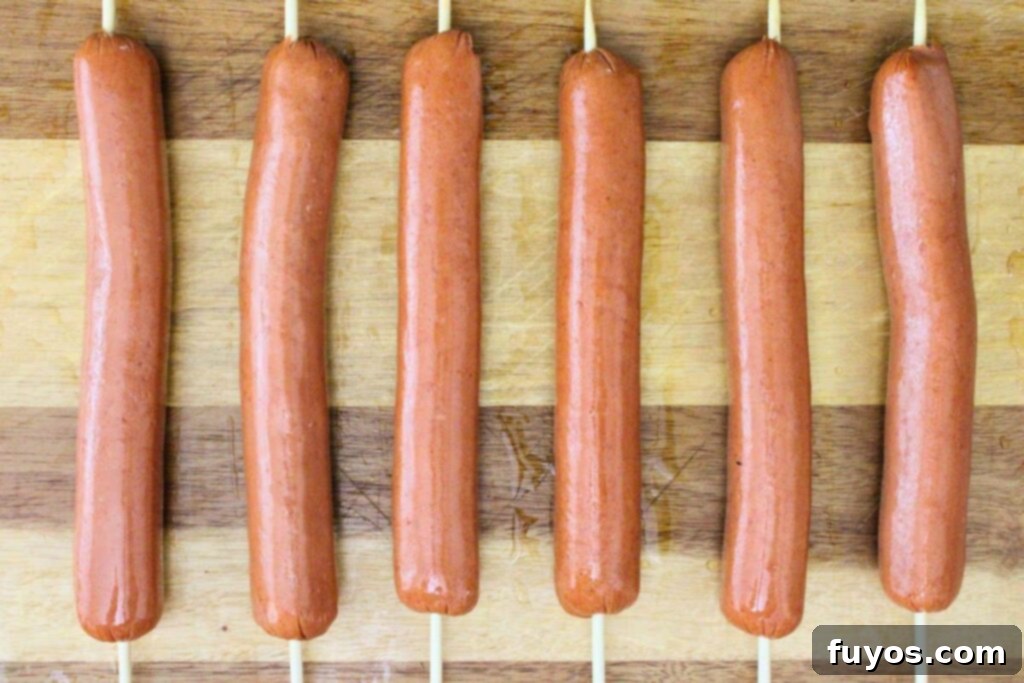Air Fryer Crispy Spiral Hot Dogs 5 thread skewer lengthwise through hot dogs