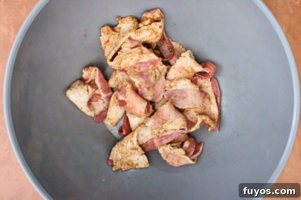 Sweet and Savory Air Fryer Bacon Apple Bites 5 in a mixing bowl combine cinnamon and sugar then coat bacon strips