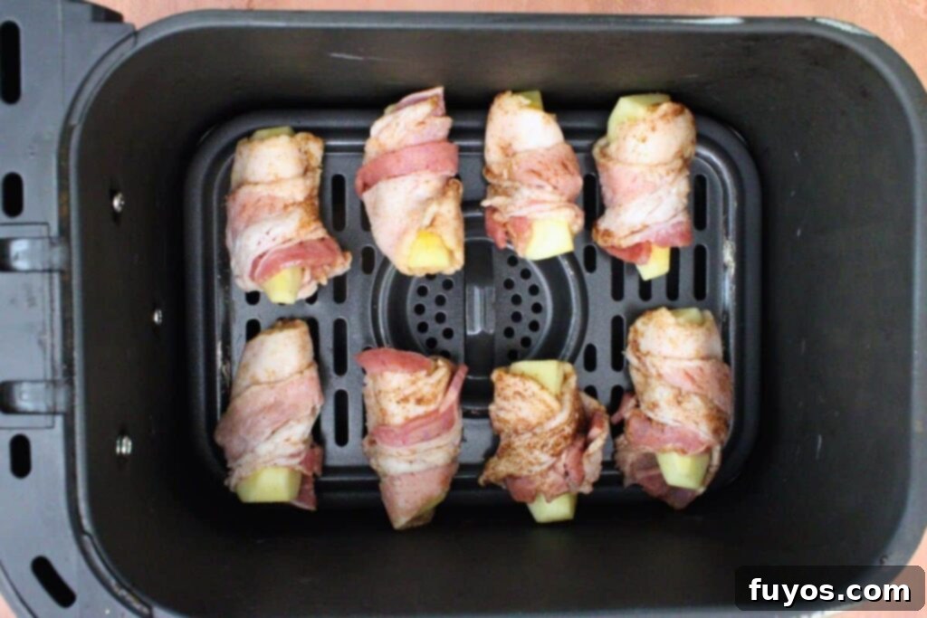 Sweet and Savory Air Fryer Bacon Apple Bites 7 place bacon wrapped apple slices in air fryer basket