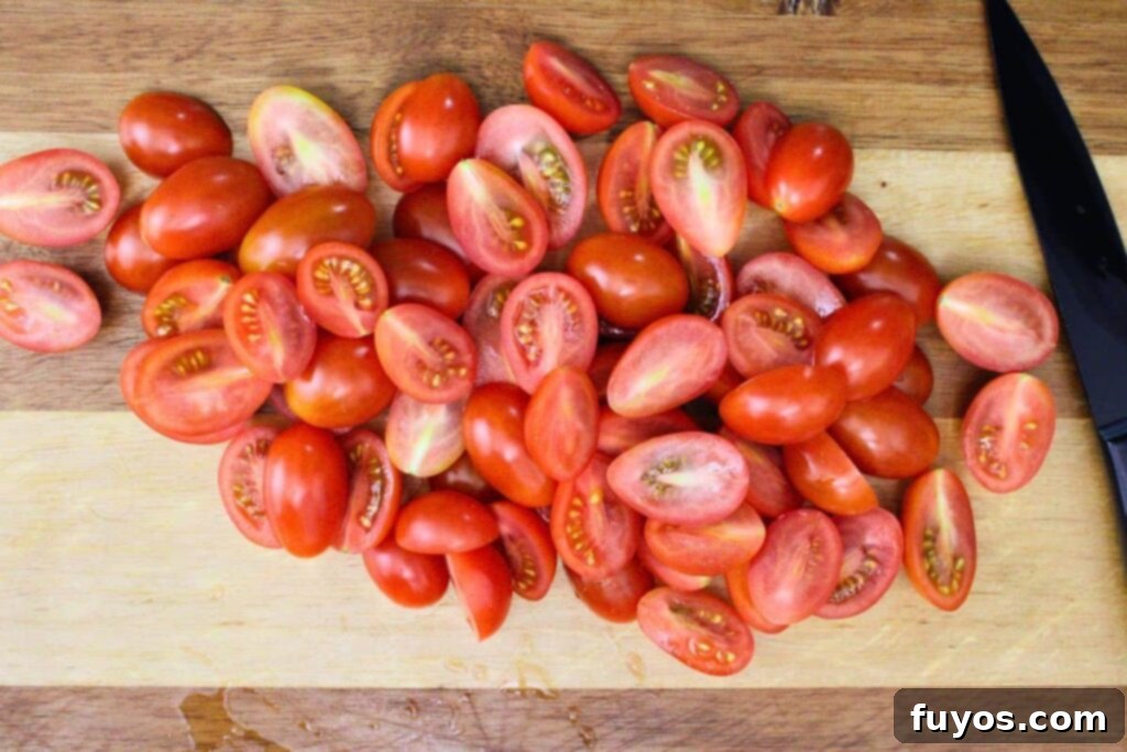 wash dry and slice cherry tomatoes in half