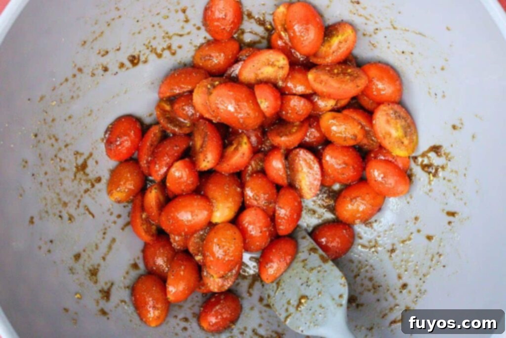 toss cherry tomatoes with olive oil, vinegar, and seasonings