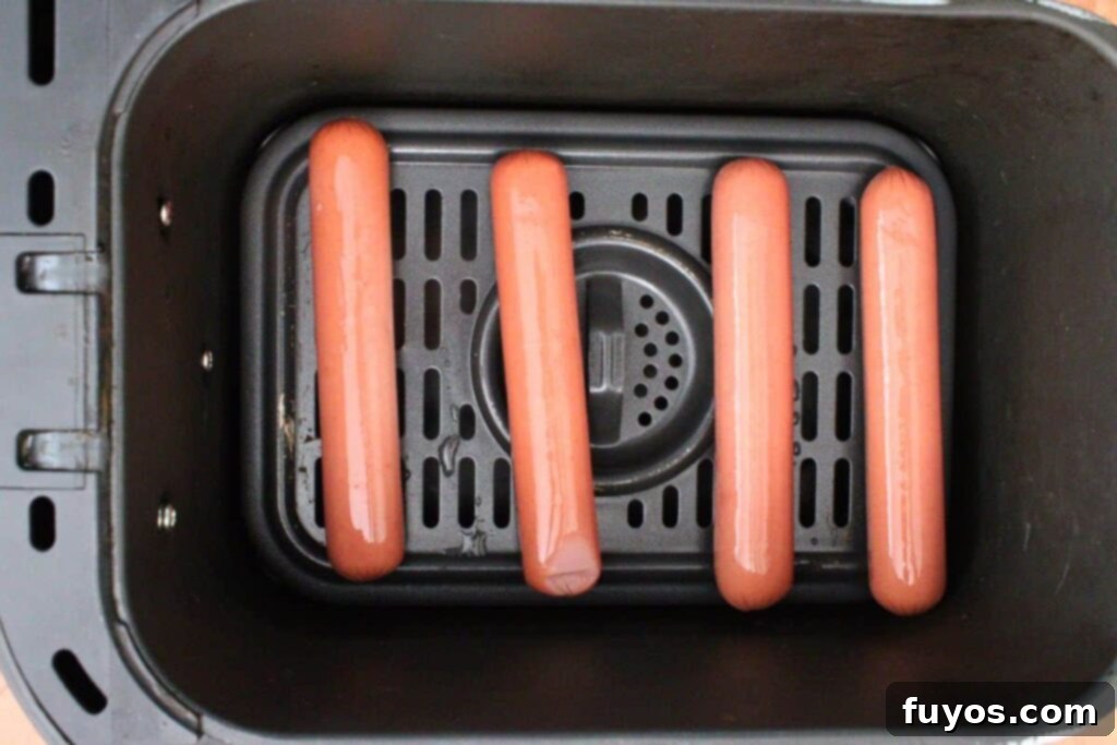 Air Fryer Thanksgiving Hot Dogs: Effortless Holiday Eats 5 place turkey dogs in air fryer basket