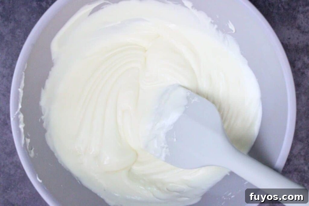 melt white chocolate chips for strawberry ghosts in a microwave safe bowl