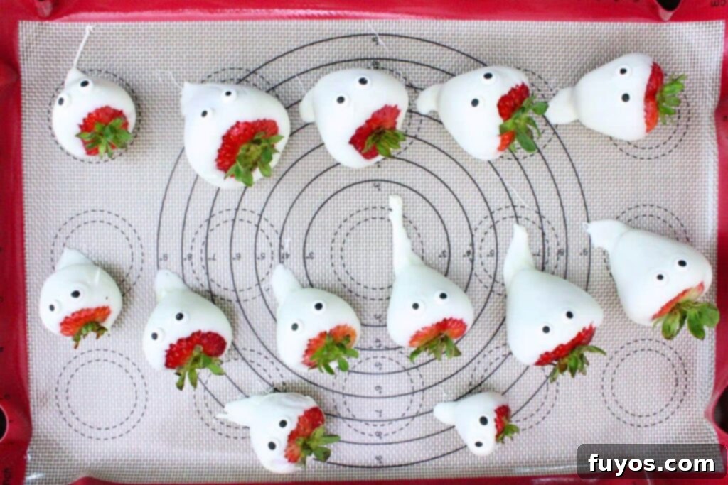 dip strawberries in white chocolate, add a chocolate tail, and add candy eyes