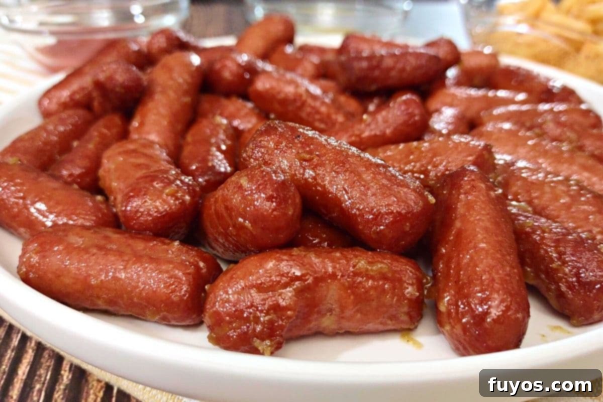27 Irresistible Air Fryer Hot Dog Creations 21 closeup of honey mustard cocktail franks on a plate