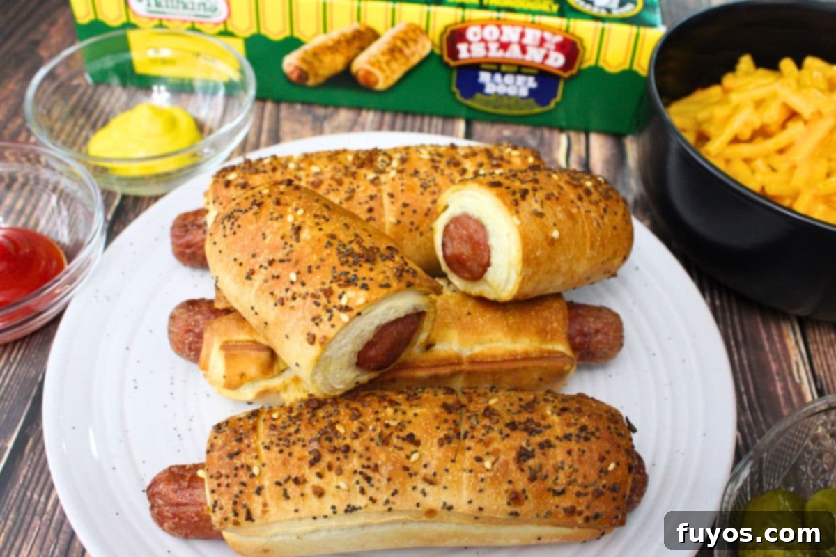 27 Irresistible Air Fryer Hot Dog Creations 27 nathan's bagel dogs on a plate with one cut in half