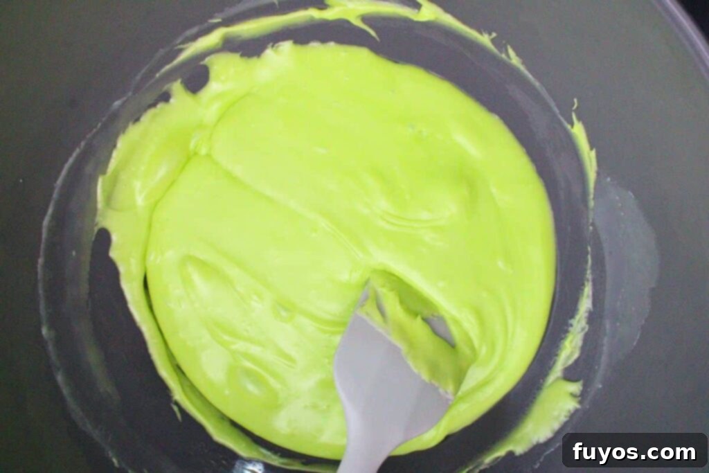 Poison Apple Fudge: A Hauntingly Easy No-Bake Treat 7 stir in green apple extract, neon green food coloring, and a pinch of salt