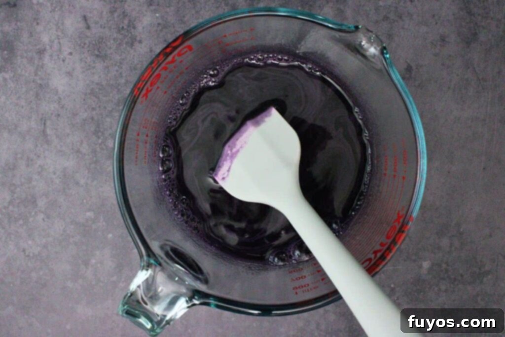 boil water and stir in jello packet with black food coloring