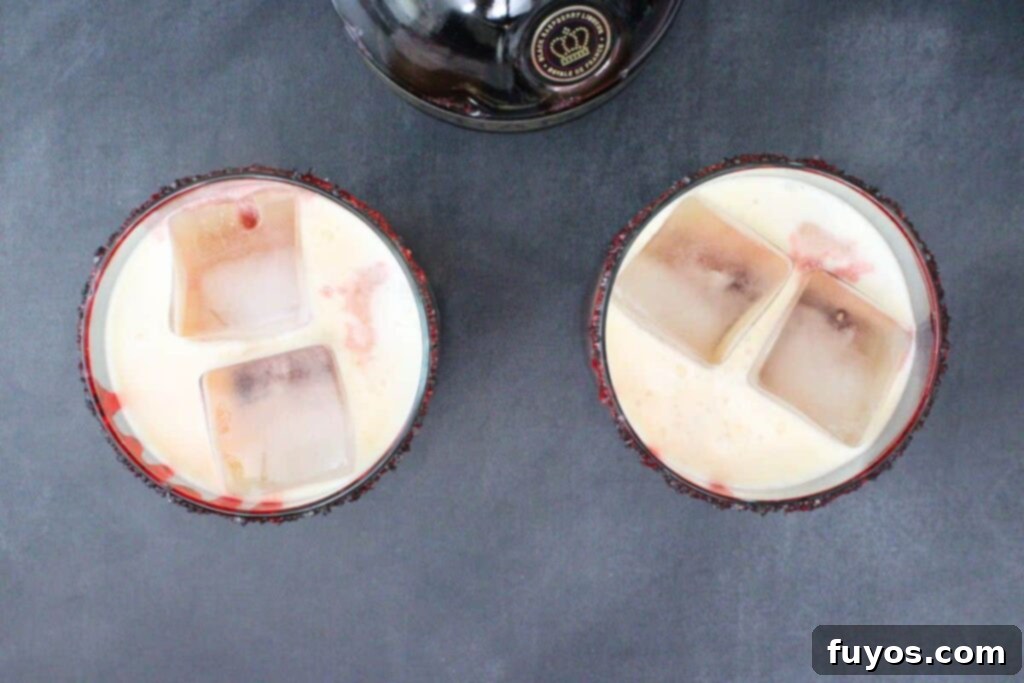 pour chambord to complete bloody tequila sunset effect