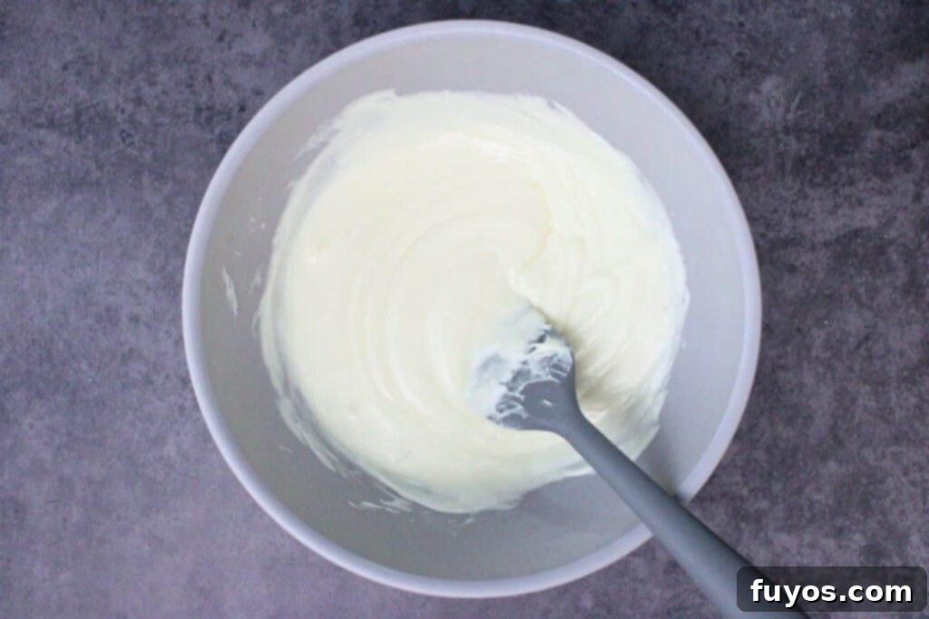 melt white chocolate chips in a microwave safe bowl for ghost pretzel coating