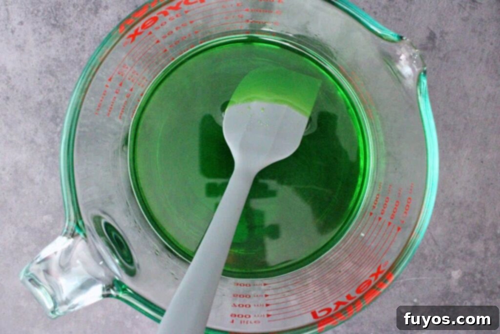 Poison Apple Jello Shots: An Adult Halloween Delight 5 boil water and add green jello