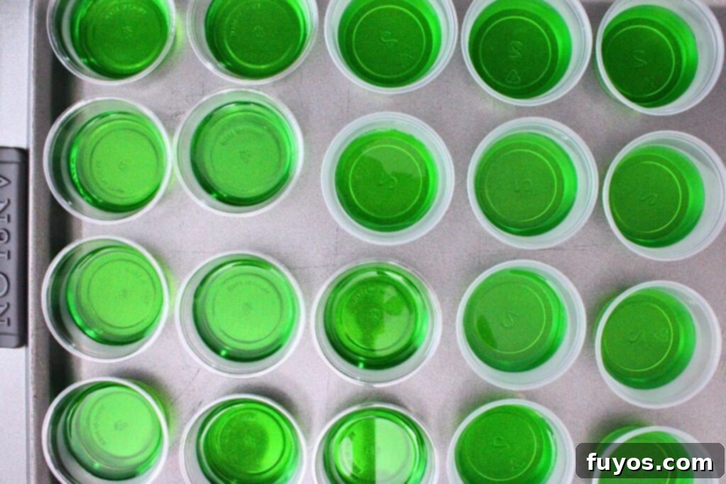 Poison Apple Jello Shots: An Adult Halloween Delight 7 add poison apple green jello base to cups