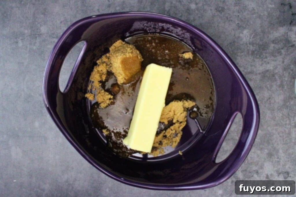 No Bake Halloween Saltine Crack Toffee 6 Adding butter, brown sugar, and water to a microwave-safe dish to make the toffee layer for Halloween crack.