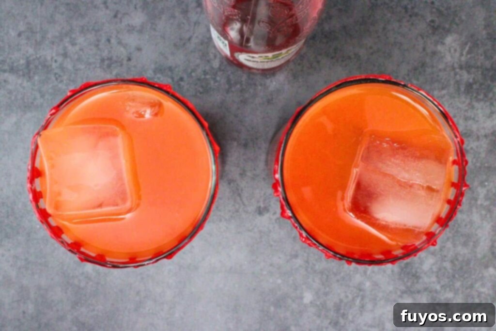 slowly pour grenadine into vampire tequila sunrise