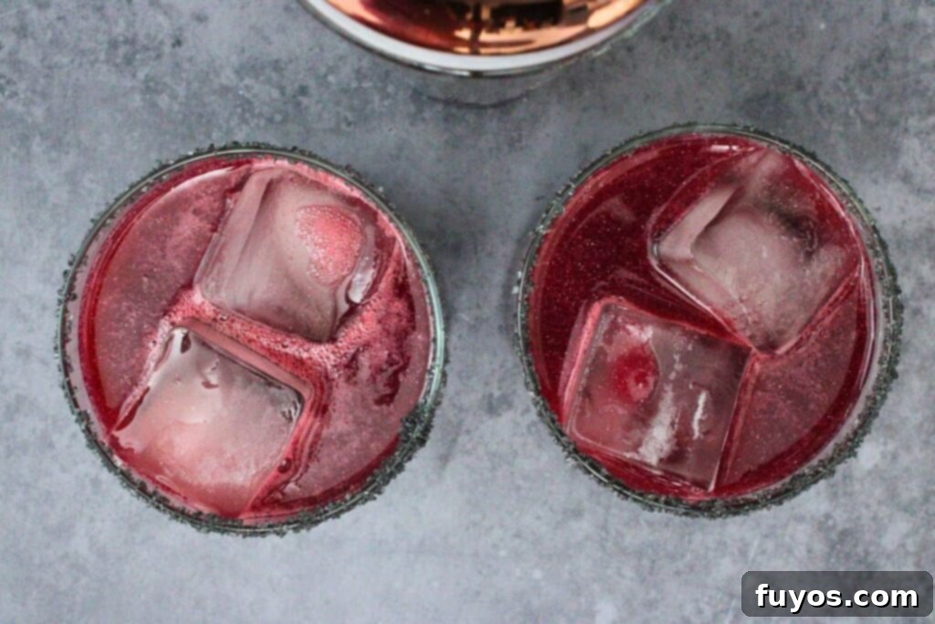 Disney's Spooky Black Magic Margarita 8 shake and strain black magic margaritas into prepared glasses