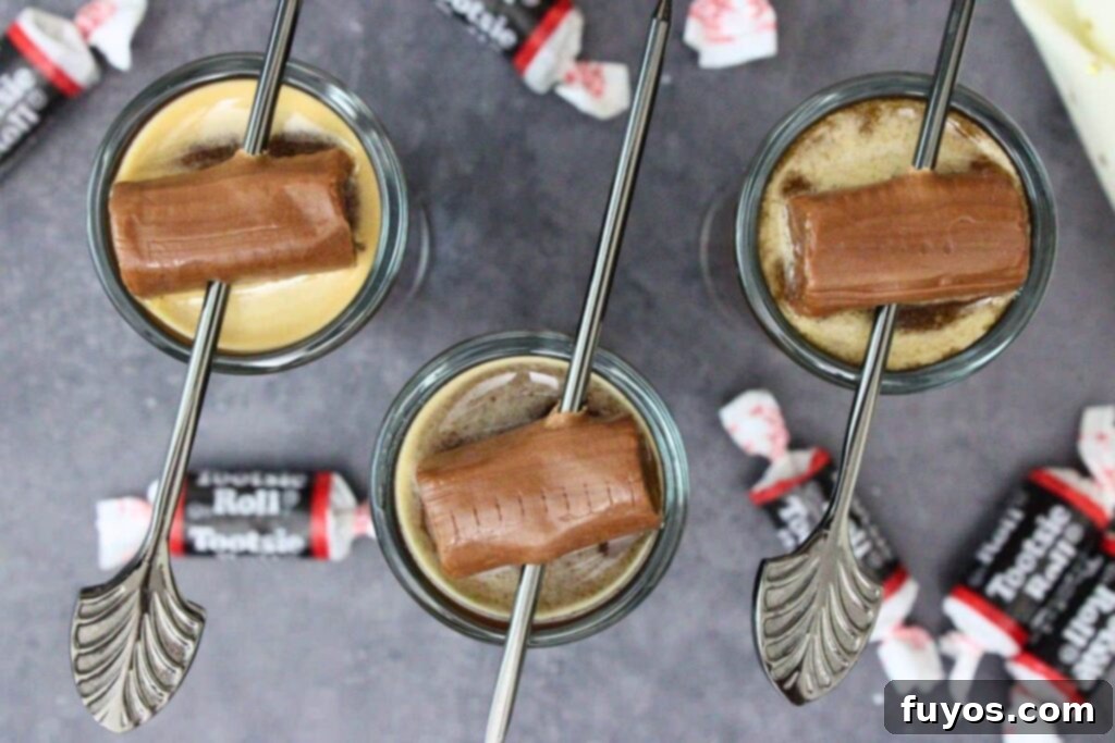 Tootsie Roll Shots Your Favorite Candy Grown Up 7 overhead view of three tootsie roll shots with candy skewers on a dark counter