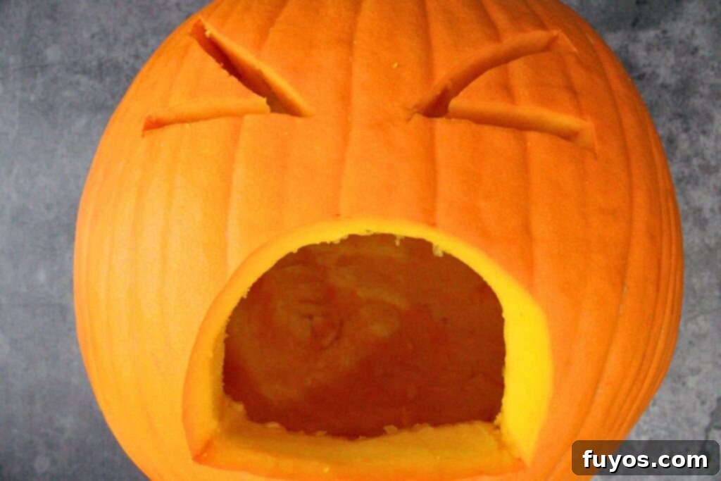 Air Fryer Halloween Monster Pumpkin Nachos 7 carve puking pumpkin face with a large mouth