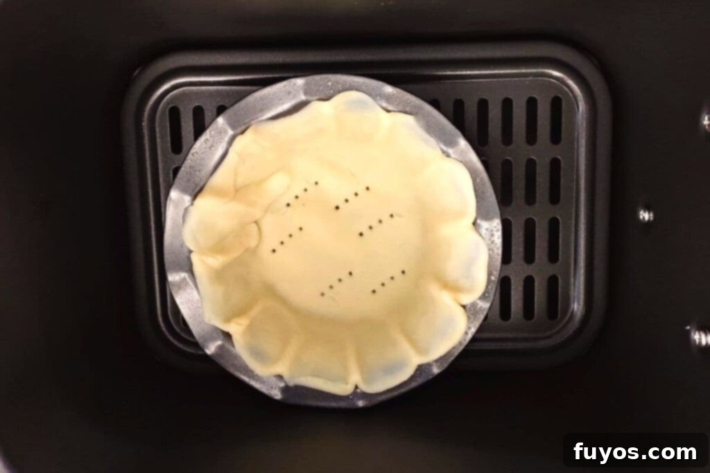 place uncooked crust in pans in air fryer basket