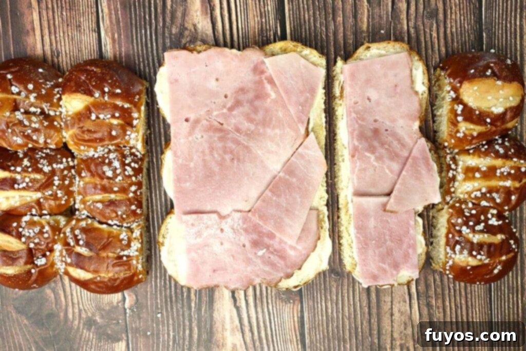 add slices of spiral ham on top of the aioli spread