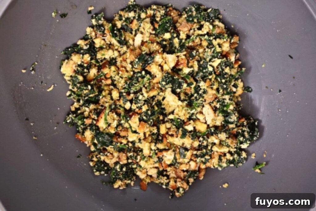 Crispy Air Fryer Spinach Bites 6 cooled spinach ball mixture in a gray bowl