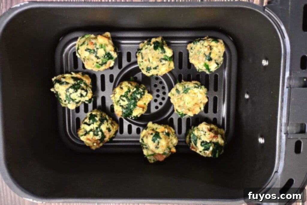 Crispy Air Fryer Spinach Bites 8 place uncooked spinach balls in air fryer basket