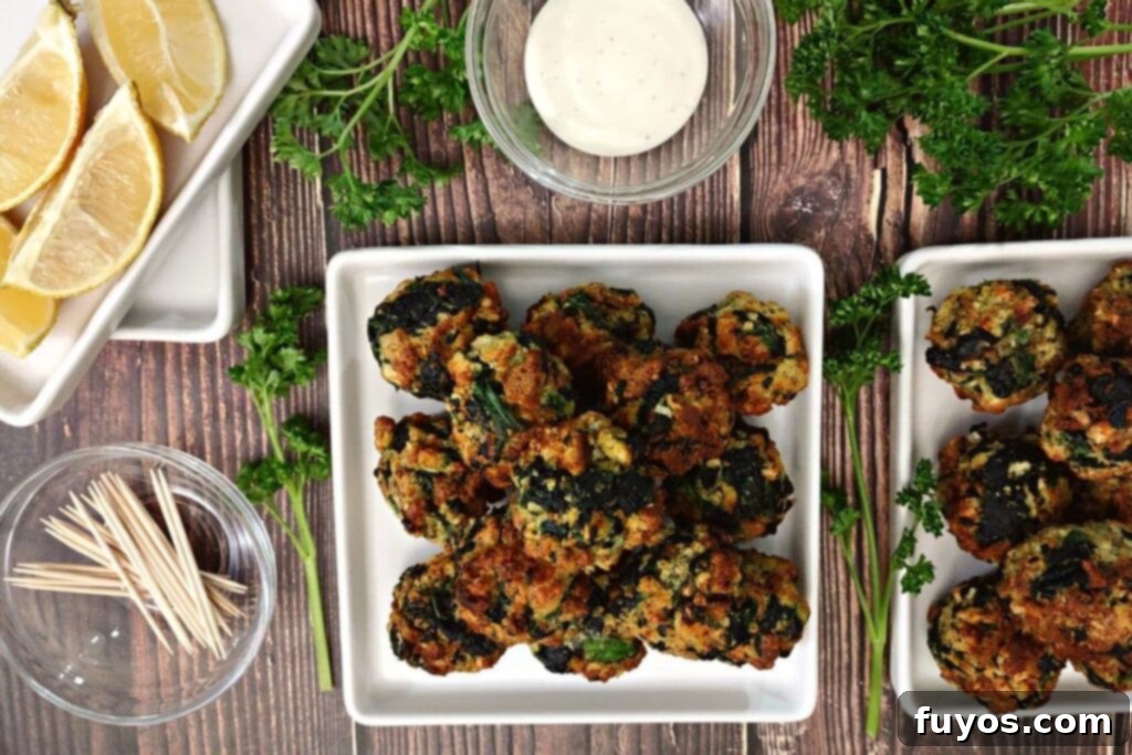 Crispy Air Fryer Spinach Bites 9 overhead view of air fried spinach balls on two sets of square plates