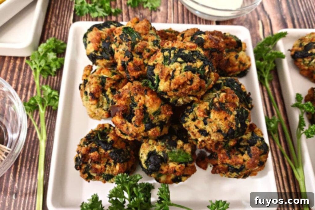 Crispy Air Fryer Spinach Bites 10 homemade spinach balls made in the air fryer on a square plate