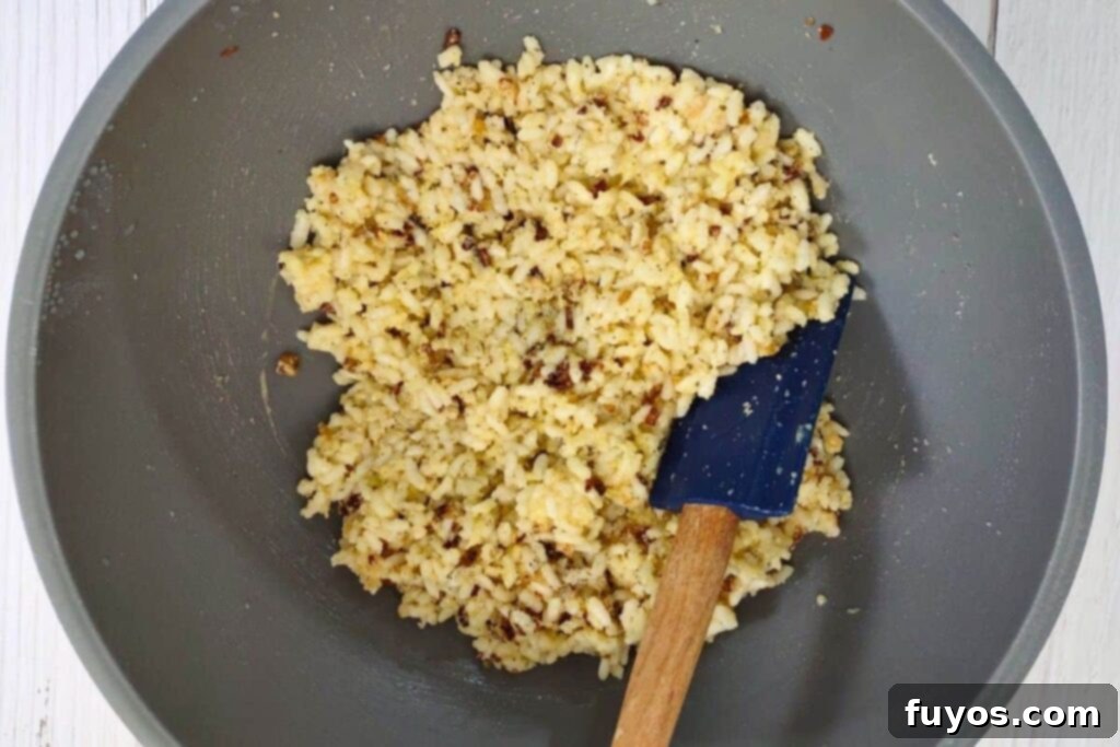 Crispy Air Fryer Arancini Mozzarella Stuffed Rice Balls 6 combine arancini mixture well in bowl, ensuring all ingredients are evenly distributed