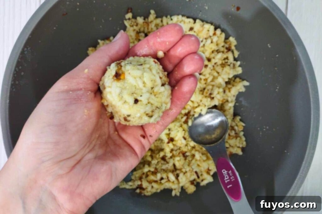 Crispy Air Fryer Arancini Mozzarella Stuffed Rice Balls 9 roll rice around the mozzarella cube to form a perfectly sealed arancini ball