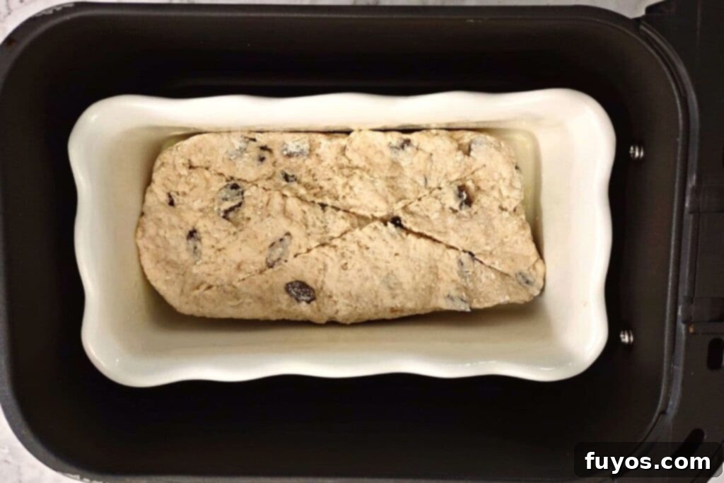 place dough loaf into air fryer basket