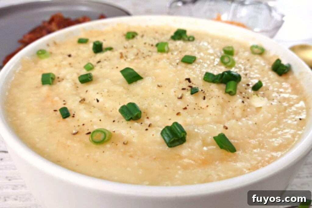 Velvety Garlic Cheese Grits in Minutes 11 closeup of a bowl of microwave grits with garlic and cheese